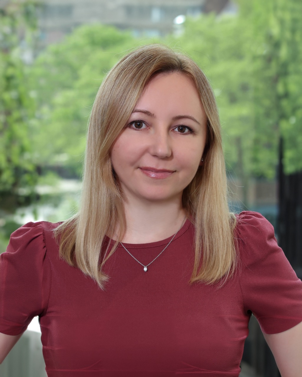 Julia Petrusic portrait with serene backdrop, Venture One team