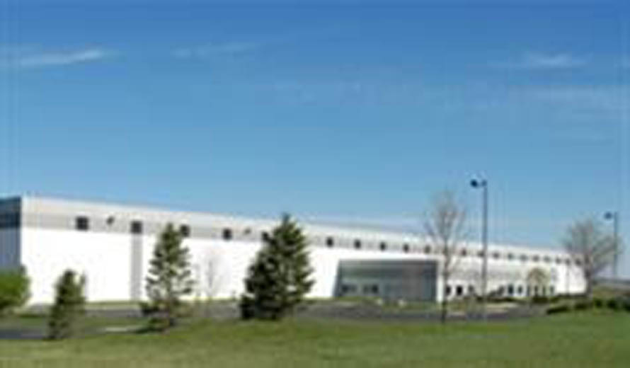 Exterior view of a 146,740 square foot industrial building in DeKalb, IL, acquired by Venture One.