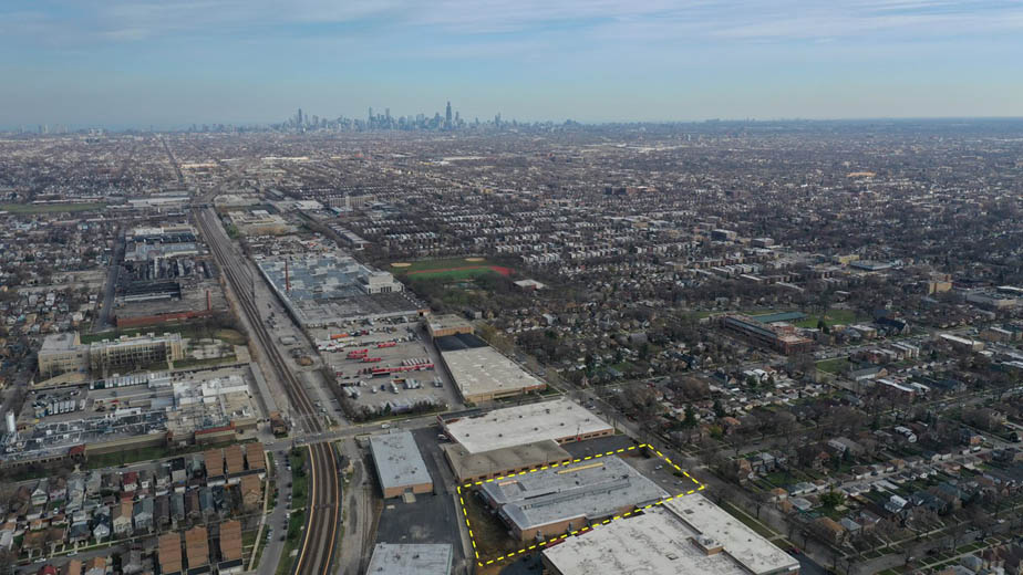 Chicago industrial site with skyline in background, aerial view