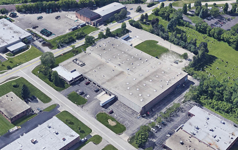 Northbrook warehouse with flat roof and green space, aerial view