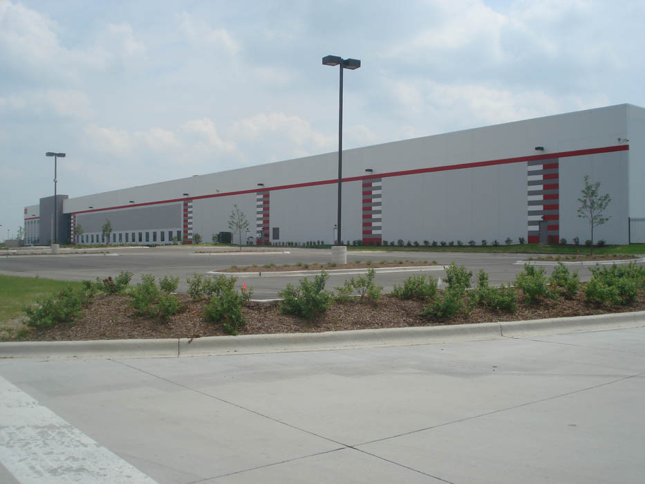 Exterior view of Park 88 industrial property with red accent stripes and landscaped parking area